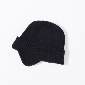 Detail shot of the navy blue knit ear protection hat showing the warm textured material