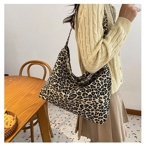 Lifestyle shot of large capacity leopard print canvas tote bag styled for daily wear