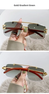 Detail of gold aviator sunglasses with green gradient lenses and wood grain temples