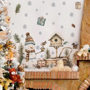 Christmas snowman wall decals with snowflakes and gift boxes on a white living room wall