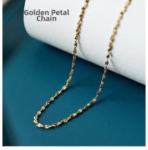 Macro shot of 18k gold plated stainless steel petal chain with detailed metallic luster