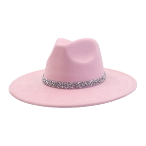 Detail of pink suede jazz hat featuring a sparkling silver rhinestone band decoration