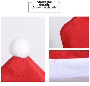 Detail showing soft red non-woven fabric and white plush pom-pom of the Santa hat chair cover