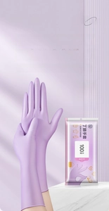 Detail of plum purple nitrile gloves showing anti-slip grip and flexible food-grade fit