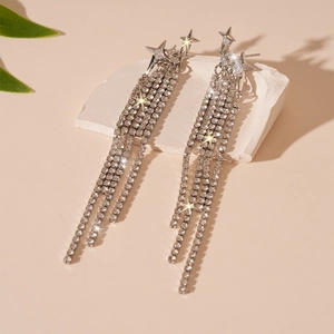 Star-shaped long tassel earrings with sparkling rhinestones and silver-toned finish