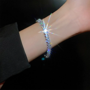 Detailed close-up of glittering zircon tennis bracelet with silver-tone metal base