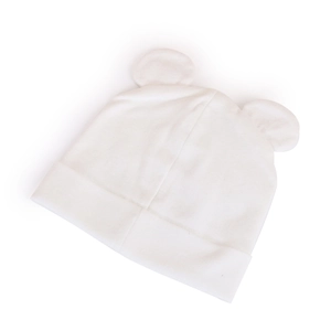 Close-up of soft white knitted baby beanie featuring cute round ear details for infants