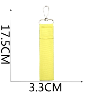 Detailed view of yellow woven ribbon keychain with 17.5cm length and metal clasp