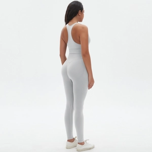 Detail view of seamless light grey yoga set with racerback bra and high-waist leggings