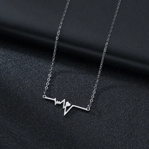 Minimalist stainless steel heartbeat necklace with a hollow heart pendant on black leather