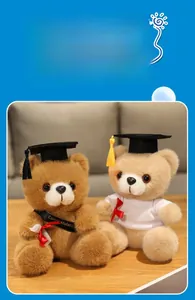 Detail of graduation teddy bears with mortarboard caps, sashes, and diploma scrolls