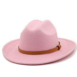 Detailed view of pink wool fedora hat featuring a brown textured leather band buckle