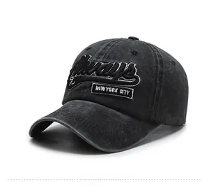 Close-up of black washed denim baseball cap featuring Always 75 3D embroidery detail