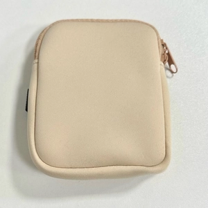 Macro detail of a beige neoprene zipper pouch for a 40oz tumbler with knitted texture