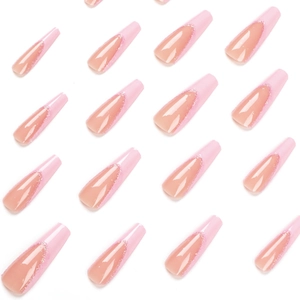 Long coffin press-on nails with pink French tips and glitter details on white background