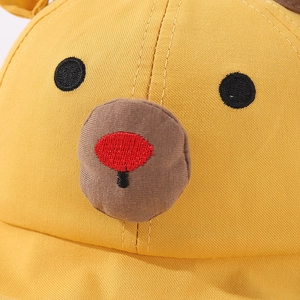 Close-up of yellow cotton baby sun hat featuring cute 3D cartoon animal face details