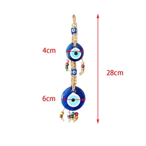 Detail view of evil eye wall hanging with 28cm length and blue glass charms