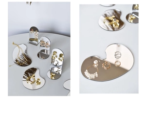 Close-up of irregular mini mirror base for jewelry display and photography props