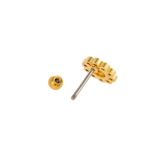 Detailed macro view of golden flower stud earring with threaded screw back ball closure