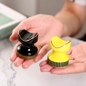 Mini ceramic cigar rest set with elegant gold trim in black and yellow plaid patterns