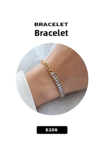 Detail of 18k gold-plated chain bracelet with rectangular cubic zirconia accents