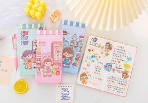 Cute pastel planner set featuring grid pages and cartoon illustrations for journaling