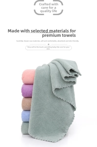 Detail showing colorful coral fleece towels with wavy petal edges and soft texture