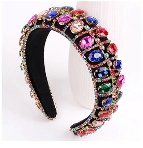 Close-up of Baroque wide padded headband with colorful crystals in gold claw settings