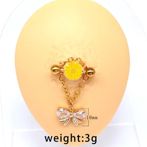 Detailed macro view showing the 10mm rhinestone bow pendant on a gold body chain