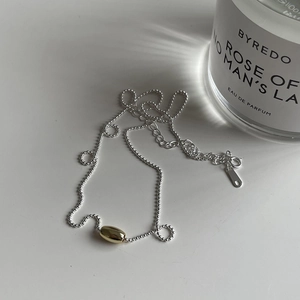 Minimalist 925 sterling silver olive bead chain necklace with a gold oval sliding bead