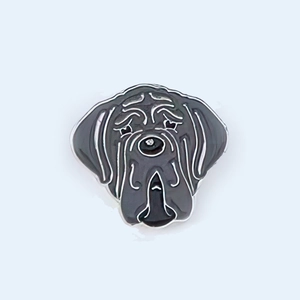 Detail of grey enamel dog badge with silver metal lines depicting a Great Dane