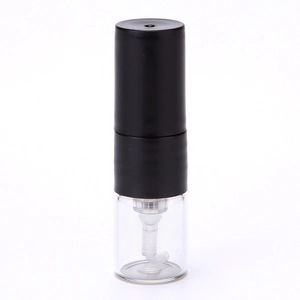 Detail of a 1ml clear glass perfume atomizer bottle with black spray pump and cap