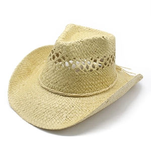 Detailed close-up of straw cowboy hat with hollow ventilation holes and woven rope trim