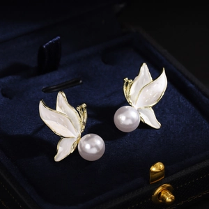 French vintage butterfly pearl earrings with white enamel on blue velvet box