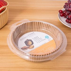 Macro shot of 160mm x 45mm round air fryer paper liners in a transparent packaging box