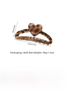 Detailed view of leopard print heart hair claw clip with size dimensions and specs