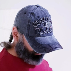 Vintage washed cotton baseball cap in grey-blue with distressed patch and embroidery