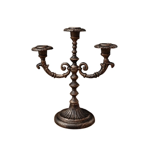 European style vintage 3-arm iron candelabra with baroque embossed details and bronze finish