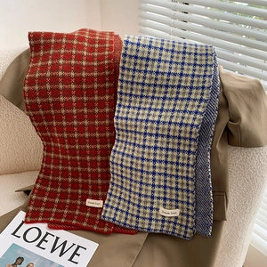 Classic plaid knit scarves in red-brown and blue-beige patterns with trendy labels
