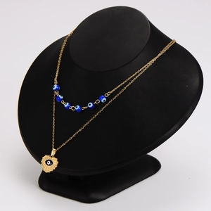 French vintage gold evil eye heart pendant necklace layered with blue bead choker
