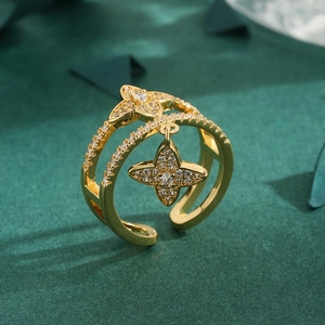 Golden double-layer open ring featuring a sparkling star and flower clover pendant
