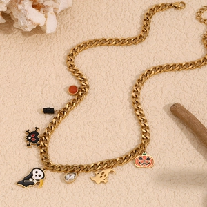 Detailed view of Halloween themed gold Cuban chain necklace with ghost and skull charms