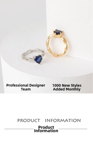 Detailed view of heart-shaped sapphire rings with twisted rope band in gold and silver