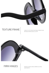 Detail of wave-shaped black frame and reinforced metal hinges for durability