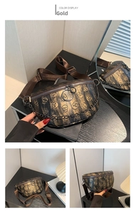 Detail of gold skull print waist bag with metal chain strap and top ring zipper closure