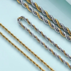Macro view of polished stainless steel twisted rope chains in gold and silver finishes
