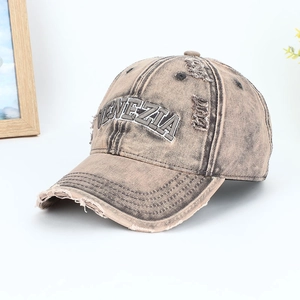 Detail of distressed cotton baseball cap with Venezia embroidery and ripped holes
