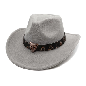 Detail of grey wool felt cowboy hat featuring bronze leopard head on black embossed band