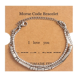 Double-layered stainless steel Morse code bracelet with crystals on Kraft card
