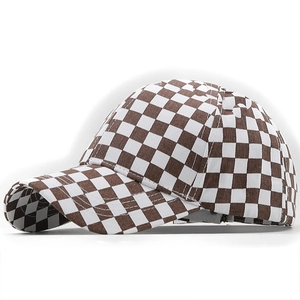Side view of a brown and white checkerboard baseball cap showing brim curve and fabric texture